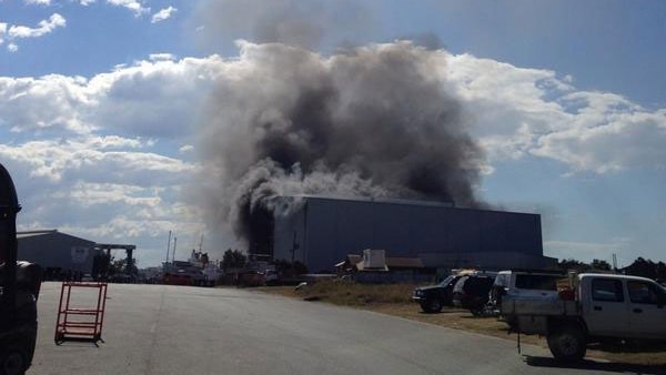 Smoke from boatshed at Hemmant on Brisbane's eastside where a Navy patrol boat caught fire.