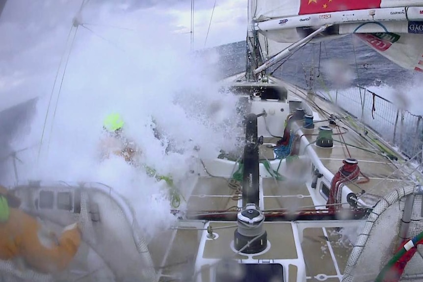 Sailor swamped by huge wave on board competitor in China to Seattle leg of Clipper race, April 2018.