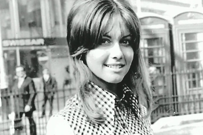 A black-and-white photograph of Olivia Newton-John as a young woman.