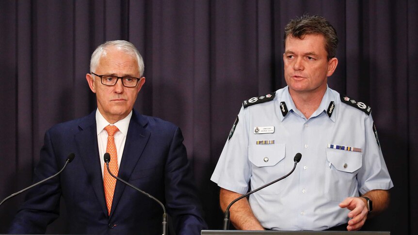 Malcolm Turnbull and Andrew Colvin speak to the media.