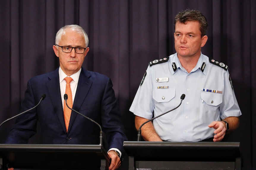 Malcolm Turnbull and Andrew Colvin speak to the media.