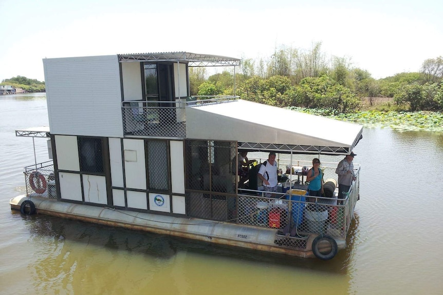 People on board a houseboat.
