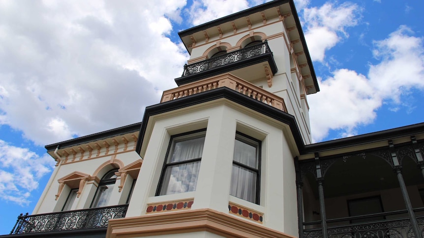 An external shot of Prospect House shows the heritage building's windows and balcony.