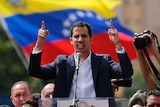 Juan Guaido, head of Venezuela's opposition-run congress, declares himself interim president of the nation at a rally.
