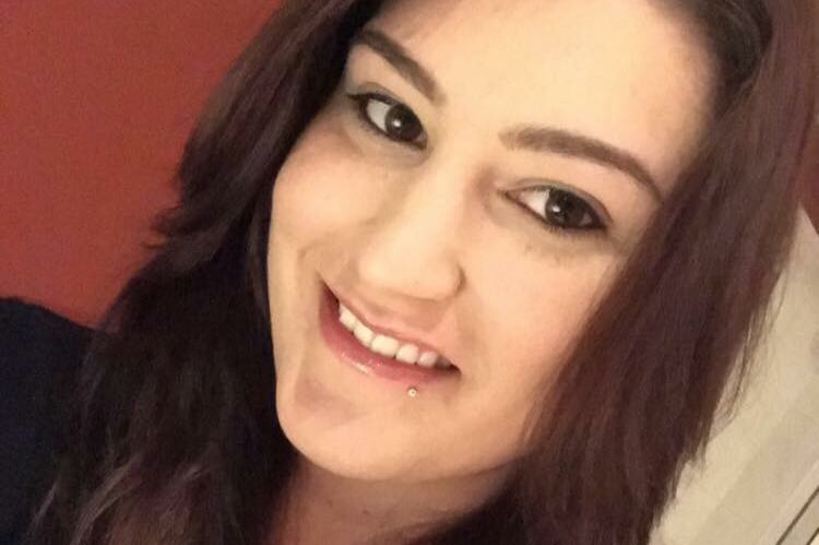 A tight head shot selfie of Katherine Walker smiling.