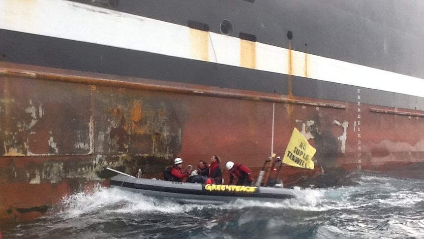 Greenpeace protesters try to stop the Margiris super trawler from docking at Port Lincoln.