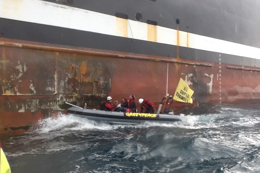 Greenpeace protesters try to stop the Margiris super trawler from docking at Port Lincoln.