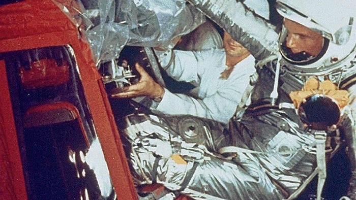 On February 20, 1962 at 9:47am EST, John Glenn launched from Cape Canaveral's Launch Complex 14 to become the first American to orbit the Earth. In this image, Glenn enters his Friendship 7 capsule with assistance from technicians to begin his historic flight.