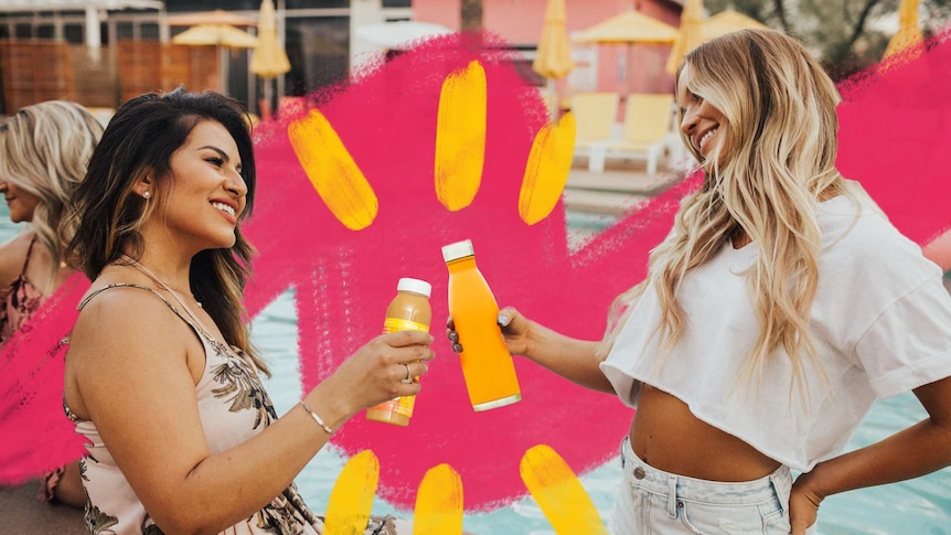 Two women toasting with soft drinks with pool in background for story about reducing alcohol consumption