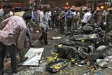 Police examine the site of an explosion at Dilsukh Nagar in the southern Indian city of Hyderabad.