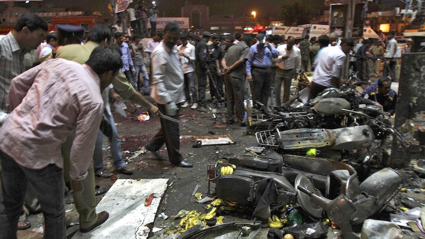 Police examine the site of an explosion at Dilsukh Nagar in the southern Indian city of Hyderabad.