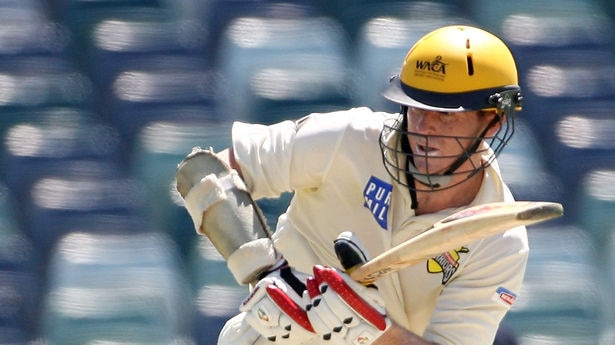 Chris Rogers works the ball away