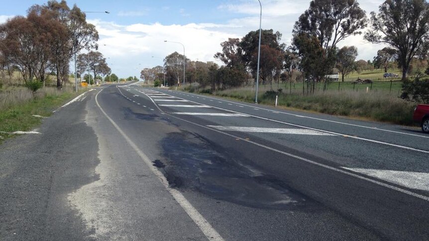 A damaged section of bitumen on the highway.