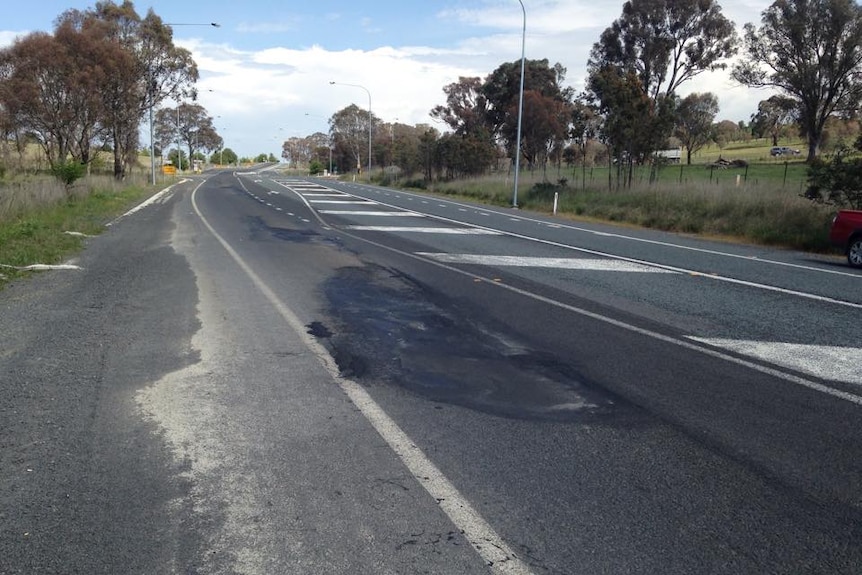 A damaged section of bitumen on the highway.