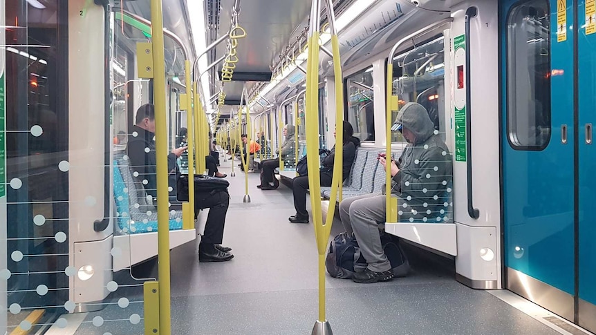 Passengers inside one of the early Metro trains on Monday morning