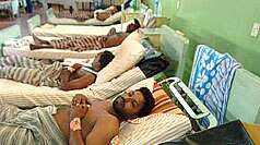 Wounded Sri Lankan soldiers lie in hospital after being airlifted following clashes with rebels.