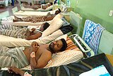 Wounded Sri Lankan soldiers lie in hospital after being airlifted following clashes with rebels.