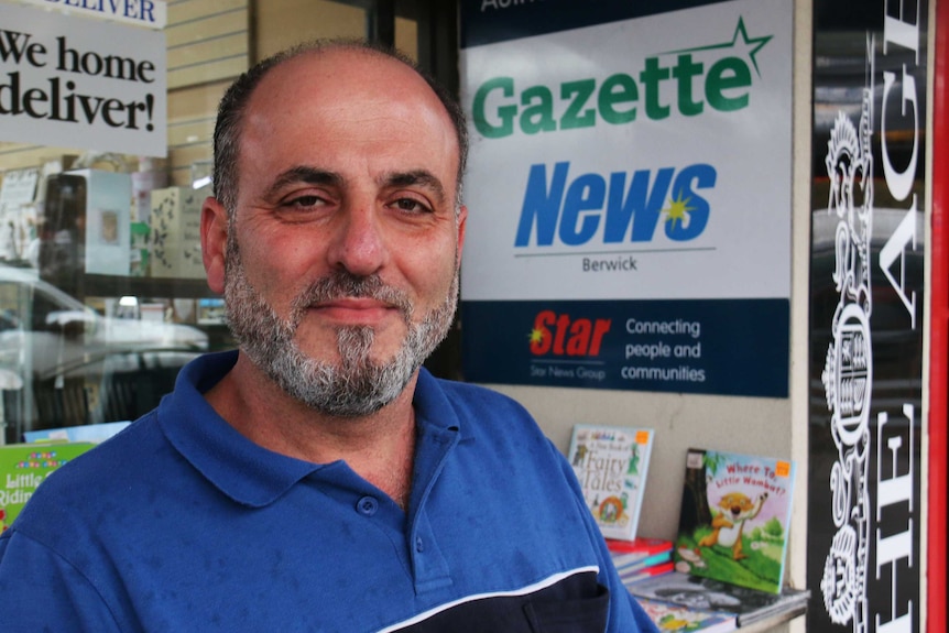 Tony Melhem standing outside a news agency in Berwick, Victoria.