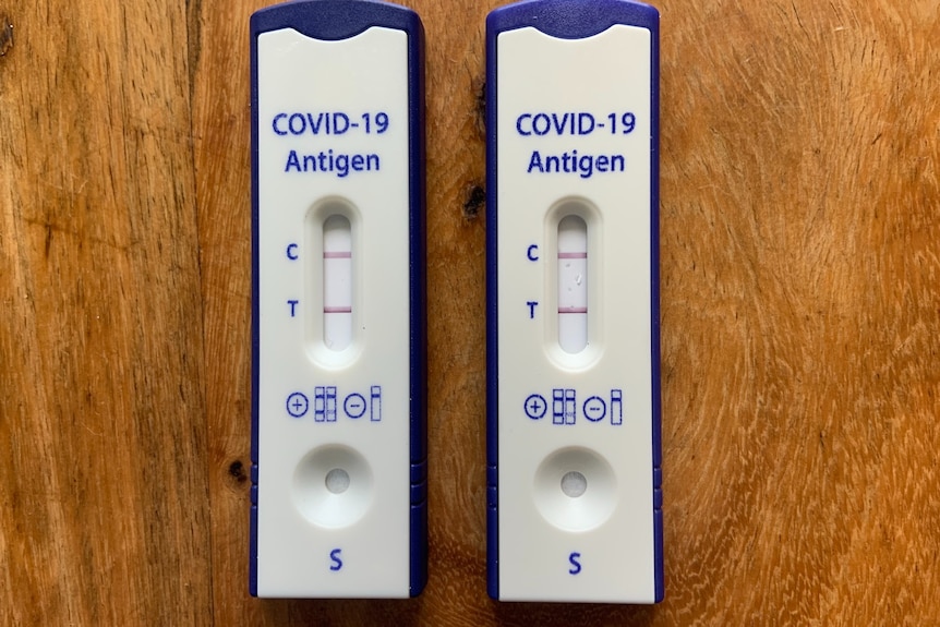 Two rapid antigen tests showing positive results for COVID-19