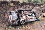 car wreckage on the side of the road