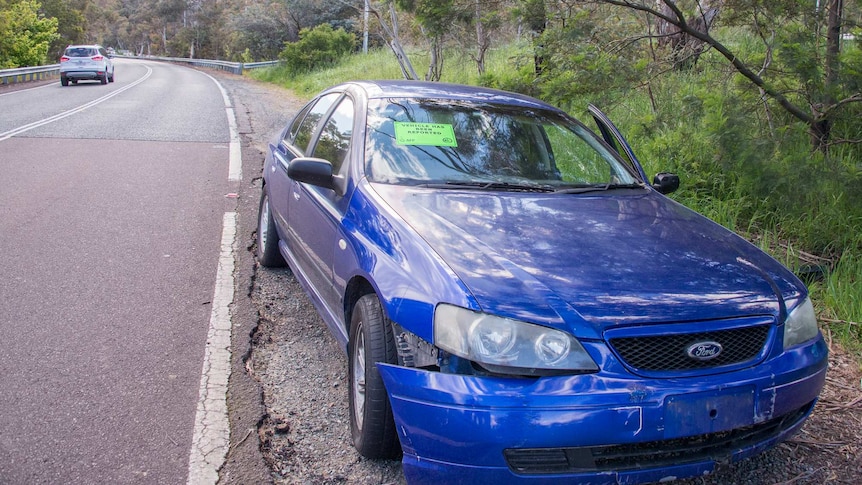 A dumped car on Lady Denman Drive in Canberra.