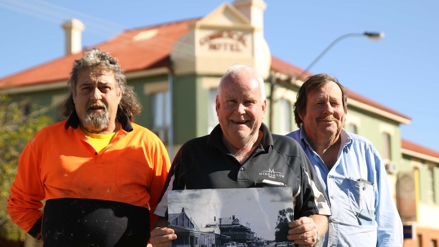 Three men standing in front of the newly refurbished Mingenew Hotel