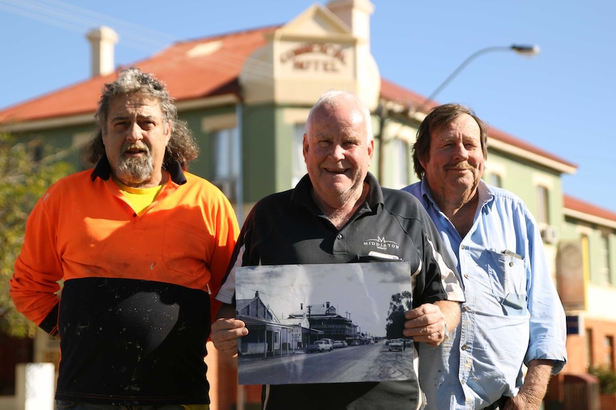 Three men standing in front of the newly refurbished Mingenew Hotel