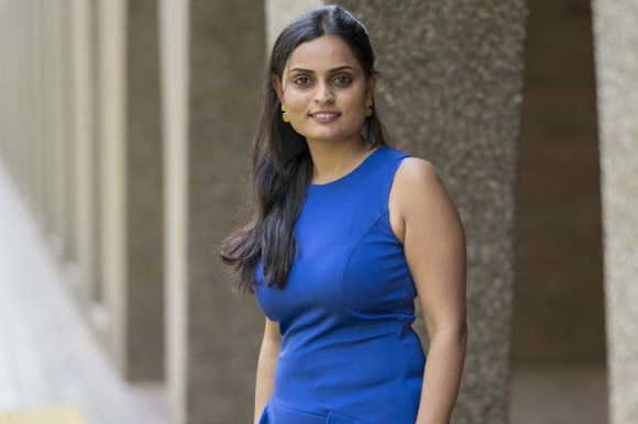 A woman in a blue dress.