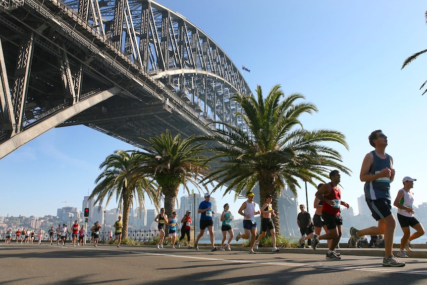 Marathon participants run under the Sydney Harbour Bridge