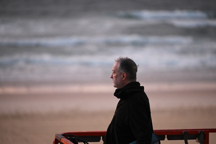 A man standing on a beach