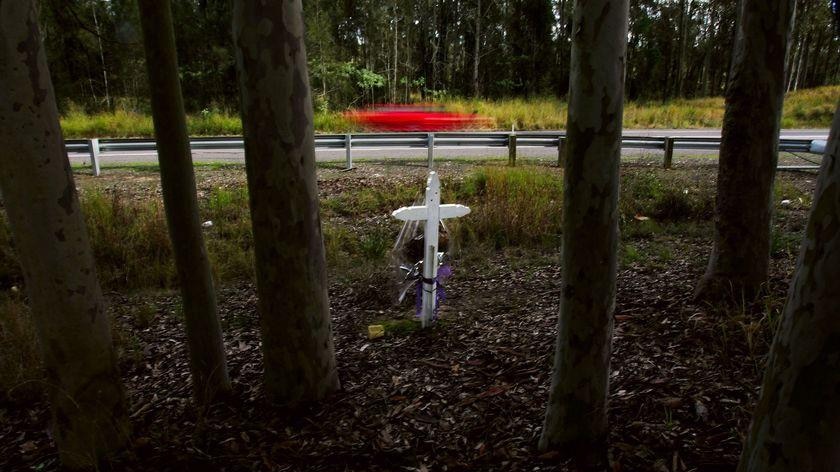 A memorial cross marks another road fatality