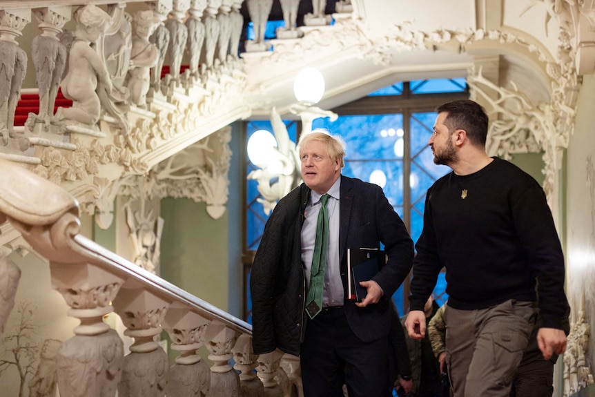 Boris Johnson and Volodymyr Zelenskyy walking together in Ukraine in January 2023
