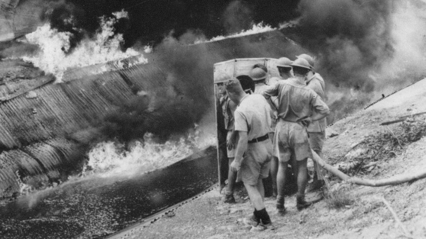 Navy personnel fight fire during Darwin air raid
