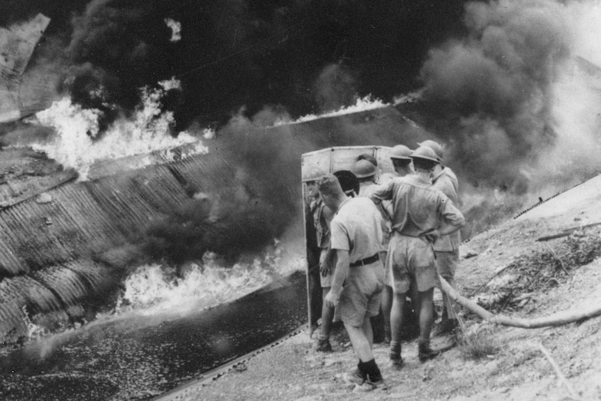 Navy personnel fight fire during Darwin air raid