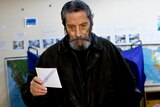 Man casts vote in Greek election