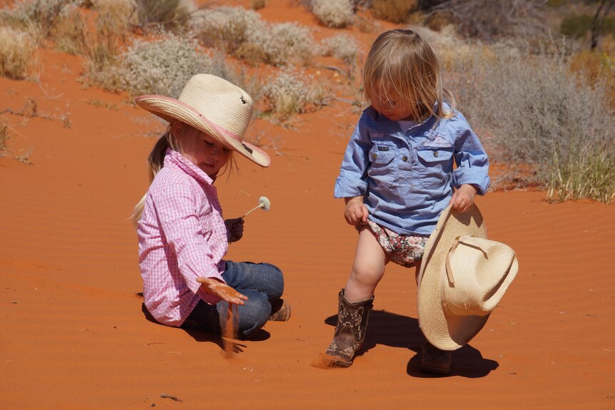 Photo of kids in red dirt
