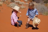 Photo of kids in red dirt