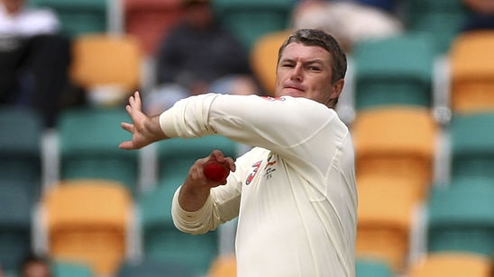 Stuart MacGill of Australia bowls