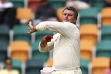 Stuart MacGill of Australia bowls