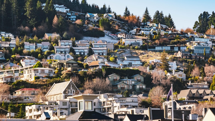 Many houses on a mountain in Queenstown, New Zealand. 