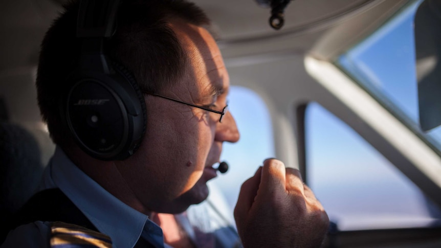 A pilot flies a light aircraft over remote Western Australia.