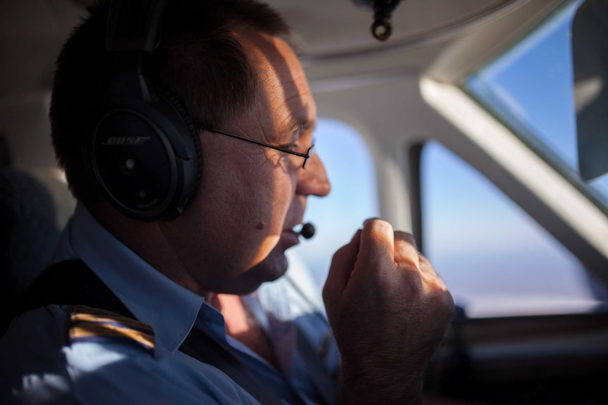 A pilot flies a light aircraft over remote Western Australia.