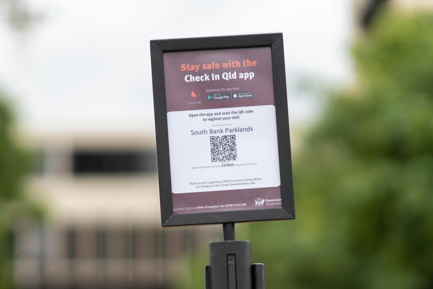 A Check In Qld app sign outside at South Bank Parklands in Brisbane.