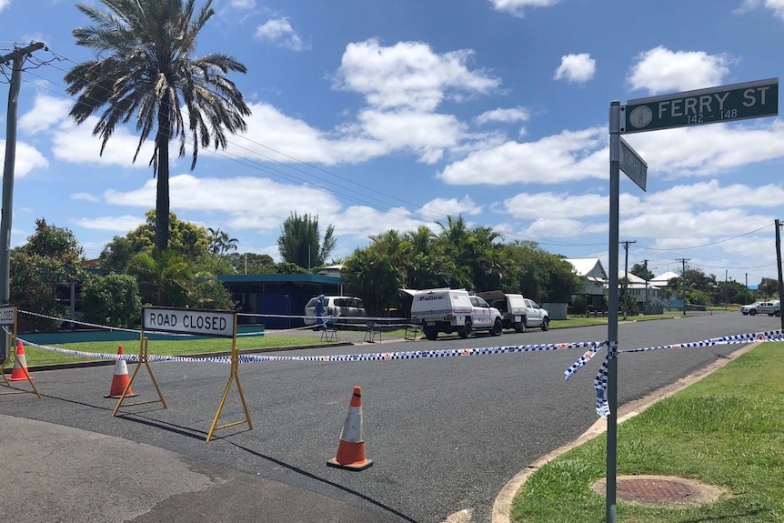 Road closed sign in the street outside the Maryborough motel where a woman's body was found on November 3, 2011.