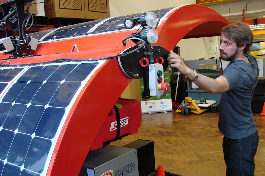 Dr James Underwood with his prototype robot powered by solar photovoltaic cells to work in vegetable fields