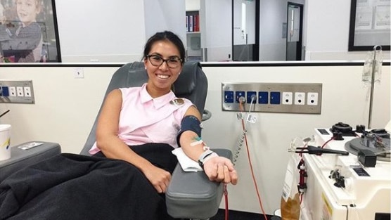 A young female surgeon donating blood.