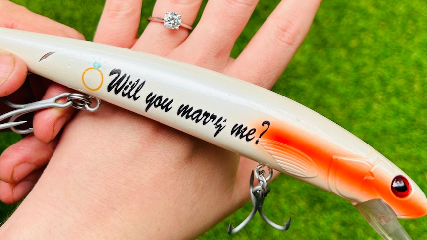 Marriage proposal via fishing lure