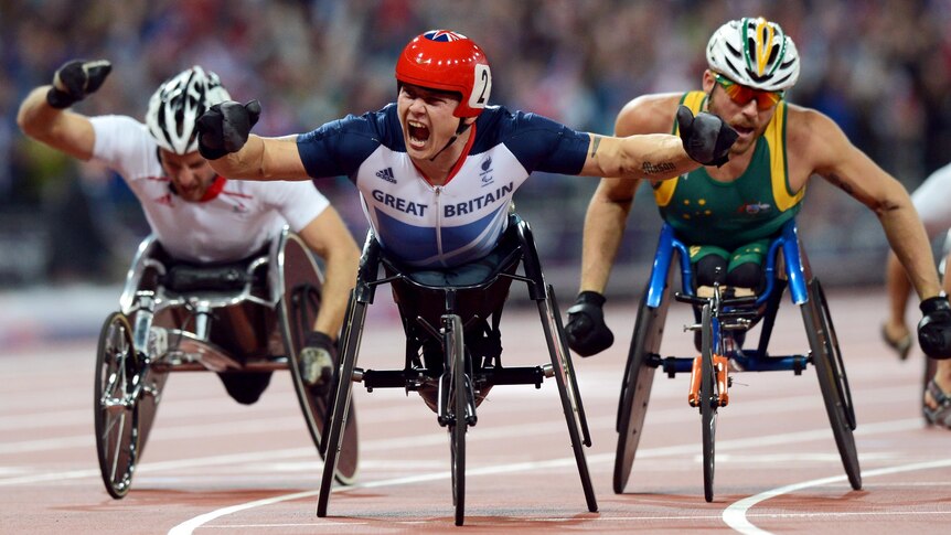 David Weir wins gold ahead of Kurt Fearnley (R) at the London Paralympic Games.