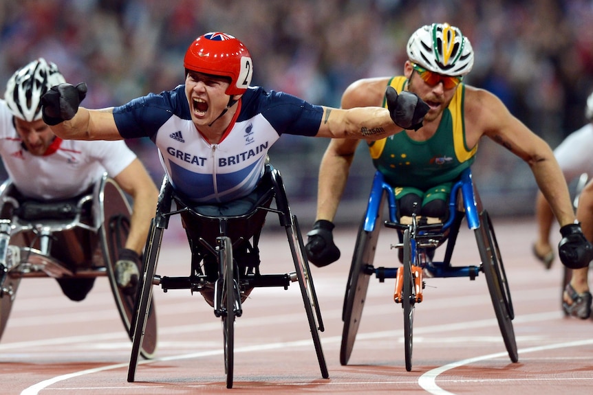 David Weir wins gold ahead of Kurt Fearnley (R) at the London Paralympic Games.