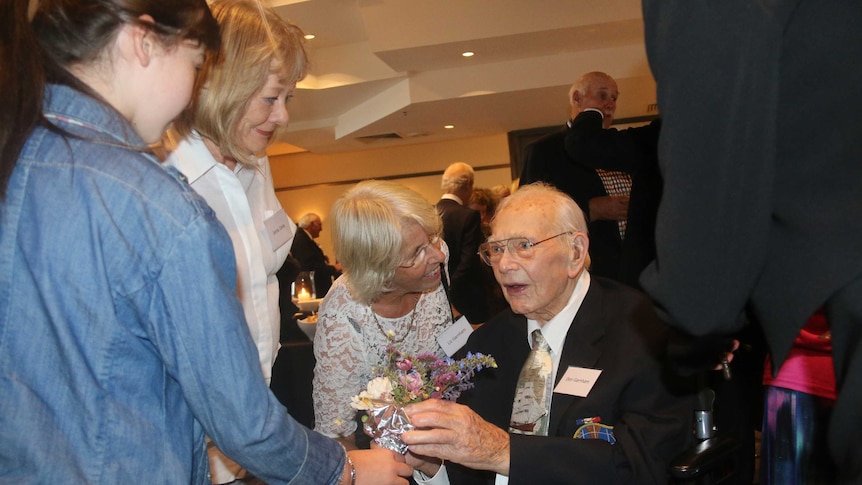 Donald Garnham talks to well-wishers at his 100th birthday.